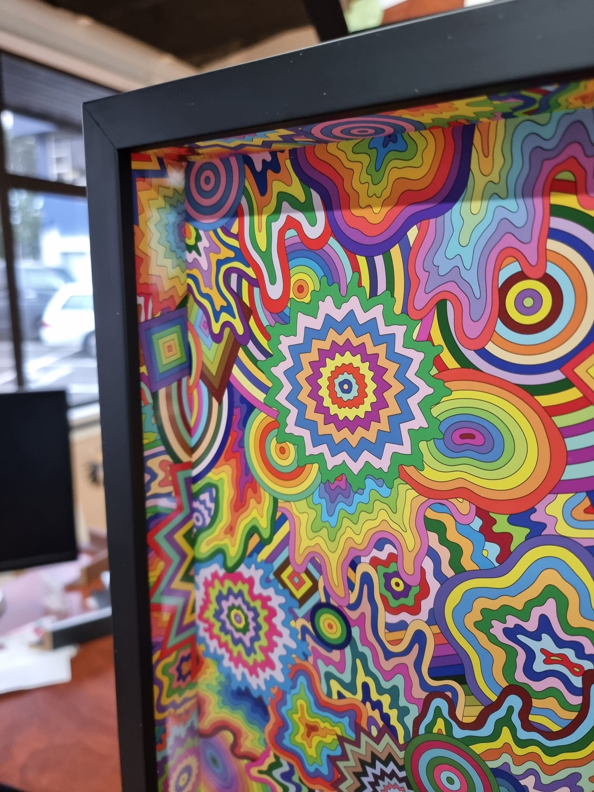 Fine art print being framed in the workshop